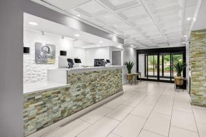 a lobby of a dental office with a reception counter at Quality Inn Albany in Albany