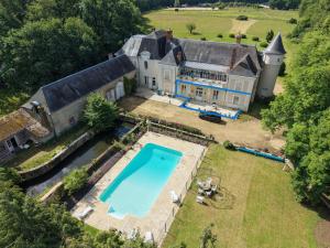 an aerial view of a large house with a swimming pool at Gîte de LA CHESNAYE in Cerelles
