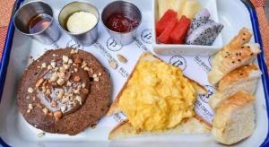 a white tray with a plate of breakfast food at Thalassa Hotel in Ko Tao