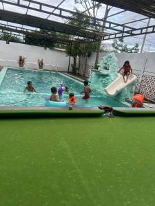 a group of children playing in a water park at Vital Point Kampot in Kampot