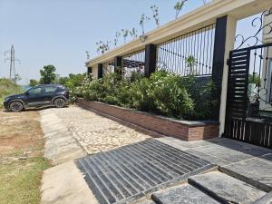 a car parked in front of a house at The Heritage villa in Udaipur