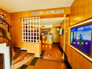 a hallway with a welcome to prison sign in a building at Presken Hotel Mojidi, Allen Ikeja in Ikeja +43 photos