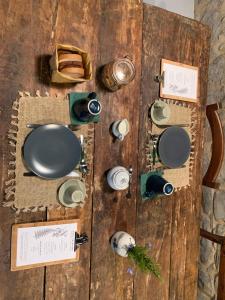 a table with plates and other items on it at La Felce e il Mirtillo in Il Palazzo +44 photos