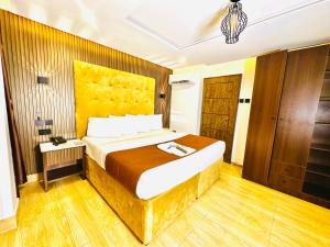 a bedroom with a large bed in a room at Presken Hotel Reliance, Allen, Ikeja, Lagos in Ikeja