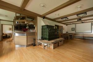 a large room with a table and a chalkboard at Karami Mountainhouse in Tržič