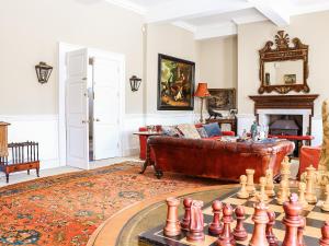 a living room with a chess board and a couch at Kyre Park in Tenbury