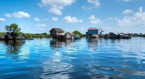a group of houses on a body of water at Lucky Star Hotel in Phnom Penh