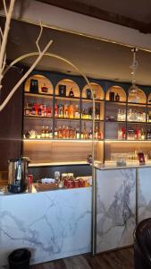 a kitchen with a counter with food on it at Crystal House Hotel in Buyant-Uhaa