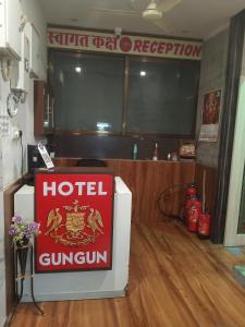 a hotel guimlin sign sitting on top of a room at Hotel Gungun Jawai, Sumerpur in Sheoganj