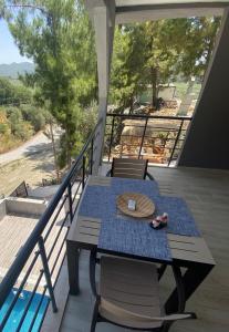 a table and chairs on a balcony with a view at MAİ Sarıgerme in Sarigerme