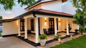 a house with a view of the backyard at CeylonAirbnb in Puttalam