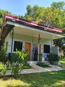 a small house with a patio at LIBYA's Guesthouse in San Juan