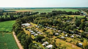 an aerial view of a village with houses and trees at Happy Glamping in Wittelte