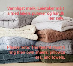 a pile of towels stacked on top of each other at Furustudio in Arendal