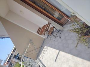 a large window in a building with a staircase at OLTREMARE in Scalea