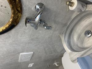 a bathroom with a sink and a faucet at Berto's house tra mare e laguna in Cavallino-Treporti