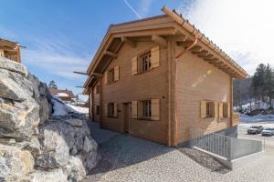 a house that is sitting on top of a mountain at Chalet Schibenstoll - Luxury & Bergblick in Wildhaus