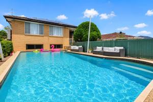 a swimming pool in front of a house at Coal d' Vine Chillout - Cessnock NSW in Cessnock