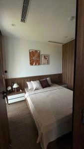 a bedroom with a large bed in a room at Khách Sạn L'AZUR in Cửa Lô