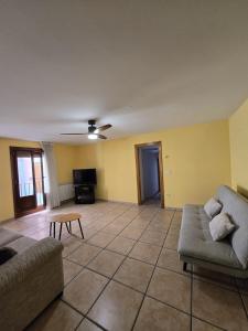a living room with a couch and a table at Apartamento Ioar in Los Arcos