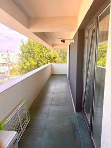 a balcony with a view of a building at DOCA Apartments 8 in Otopeni
