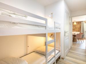 a room with two bunk beds and a desk at Les Grizzlis N 20 - 2P6 in Saint-Sorlin-dʼArves +9 photos