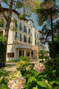 a large building with flowers in front of it at Lale Boutique Hotel in Sapanca