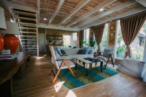 a living room with a couch and a table at Luxury 3-Bedroom Villa with Private Pool in Pulukan