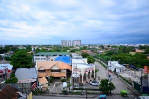 a view of a city with buildings and a street at California Signature Suites in Sudtungan