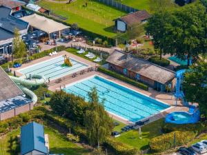 an overhead view of a swimming pool at a resort at Charming Chalet Near Efteling in Kaatsheuvel +11 photos