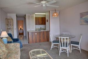 a living room with a couch and a table at Maui Vista 2207 in Kihei