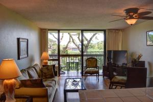 a living room with a couch and a table at Maui Vista 2220 in Kihei