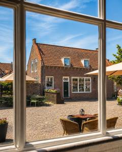 a view of a building from a window at de Campveerse Toren in Veere
