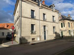an old building on the corner of a street at chez Alain et Sylvie in Braine