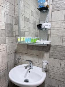 a bathroom with a sink and a mirror at Moss House in Sevan