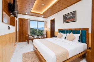 a bedroom with a bed and a large window at The Elena Dogri Homes, A Comfortable & Luxury Stay - Best Selling Cottage 2025-26 in Shimla