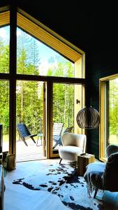 a living room with a large sliding glass door at Vuokatti Weekend Platinum in Vuokatti