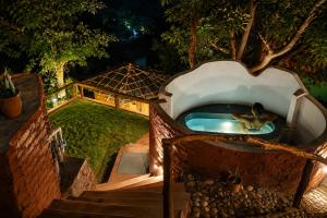 an overhead view of a pool in a backyard at Aavya Creative Wellness Retreats in Rishīkesh