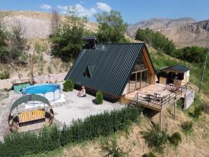 an overhead view of a tiny house with a pool at Triangle house in Areni