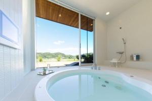 a large bathroom with a large tub and a large window at The SATOYAMA HILLS FK1 in Futtsu +83 photos