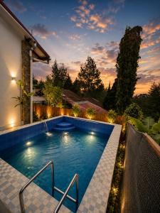 a swimming pool in the backyard of a house at The Haven 3BR Private Pool Lembang in Tegalharendong