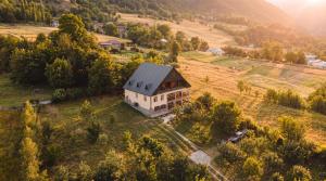 an aerial view of a house in a field at Becho House in Becho