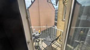 a balcony with a table and chairs on it at Hotel und Gaststätte zum Grafenwall in Recklinghausen