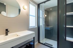 a bathroom with a sink and a shower at Camping le Clou in Coux-et-Bigaroque +46 photos