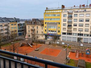 a view of a playground in a city with buildings at Comfort & Central Rooms in Luxembourg