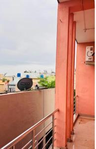 a balcony with a view of a building at priya inn royal in Lakhīmpur