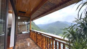 a balcony with a view of the mountains at Sapa Rose Garden Resort in Sapa +21 photos