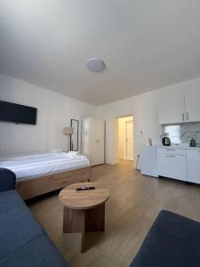 a living room with a bed and a coffee table at Capital Stay Old Town in Sarajevo