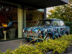 a colorful car parked in front of a building at ibis Styles Budapest Citywest in Budapest
