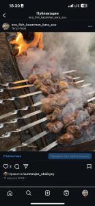 a bunch of hamburgers cooking on a grill at ЭКО БАЛЫК Седеп Юурты 